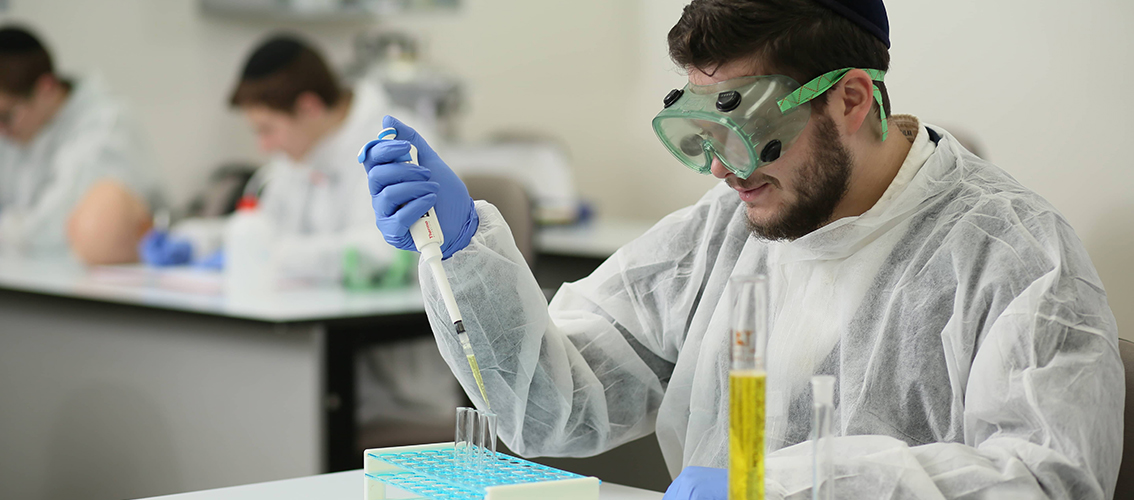 TCI Student in a lab